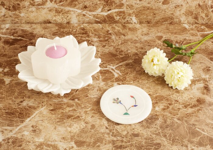 A Round marble coaster of 3.5 inches diameter and 0.5 cm thickness.