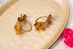 Brass wildflower napkin rings