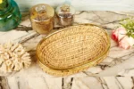 Oval cane tray with brass edging